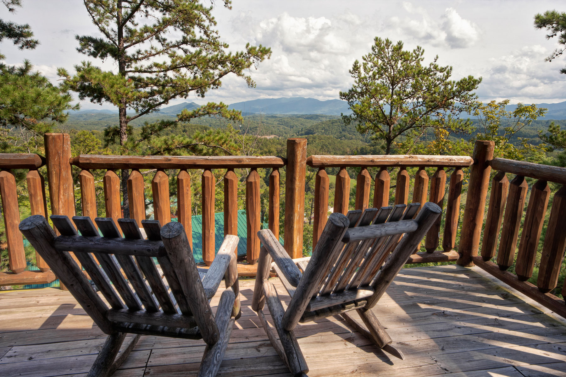wooden chairs overlooking mountains