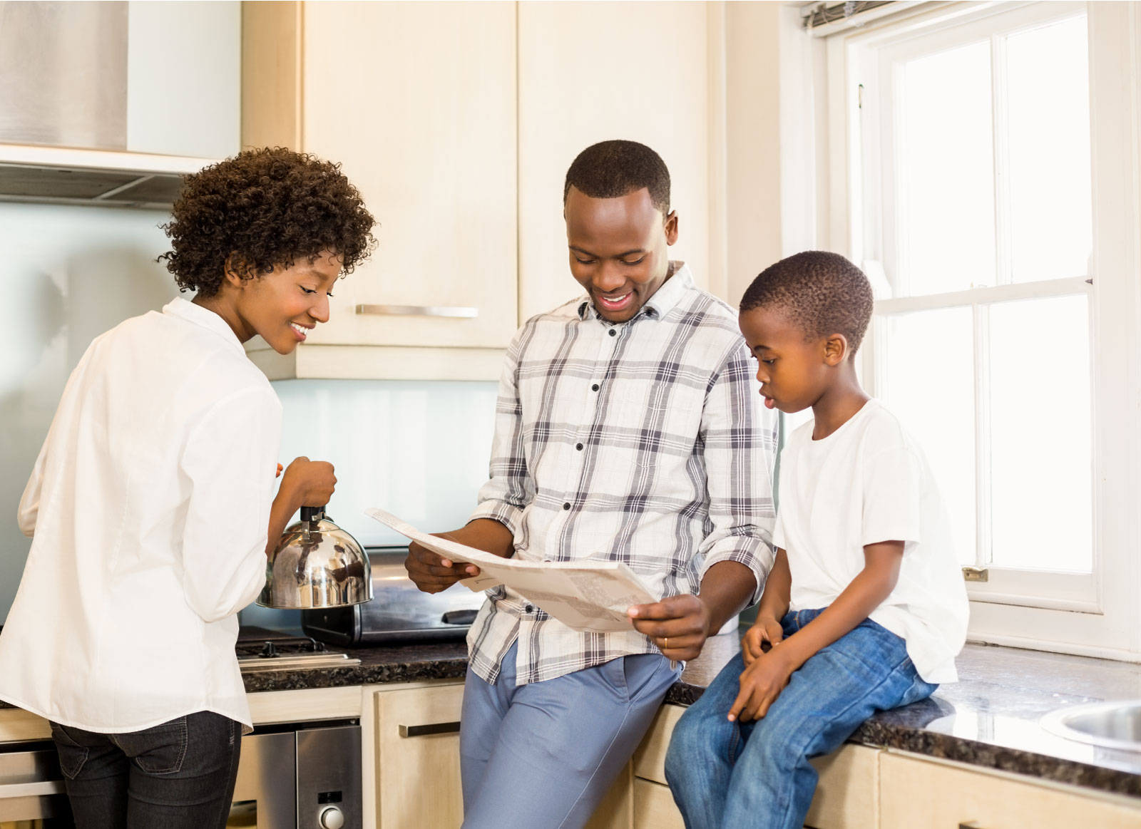 Family in kitchen reading unclaimed property names in local newspaper