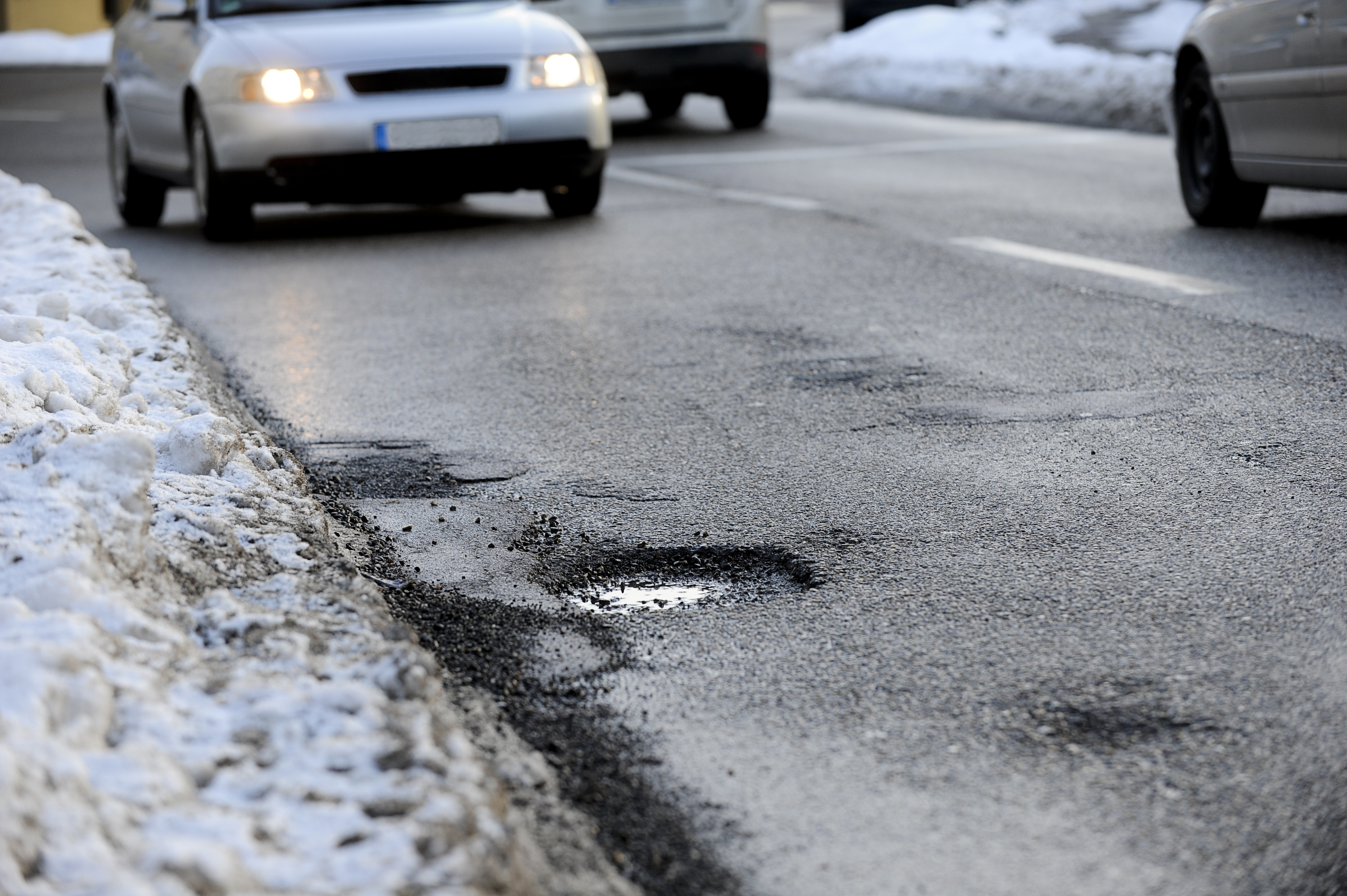 pothole caused by icy weather conditions